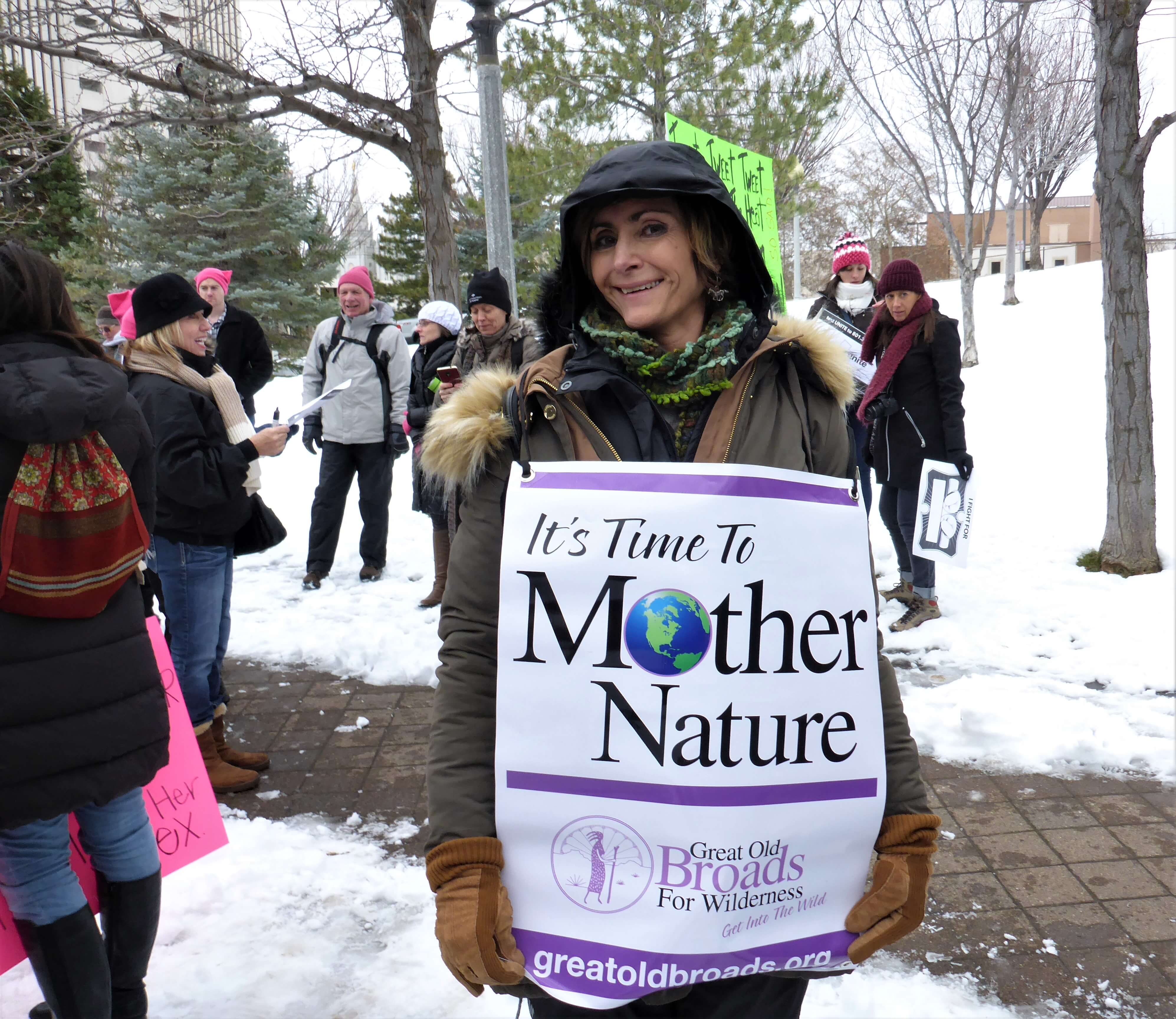 Jodi pic Woman holding a Great Old Broads poster that says "It's time to mother nature"