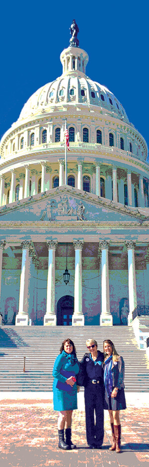 Women standing in front of the U.S Capitol building