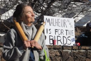 great-old-broad-protestor-one_h Woman protesting with a sign behind her stating "Malheur is for the birds"